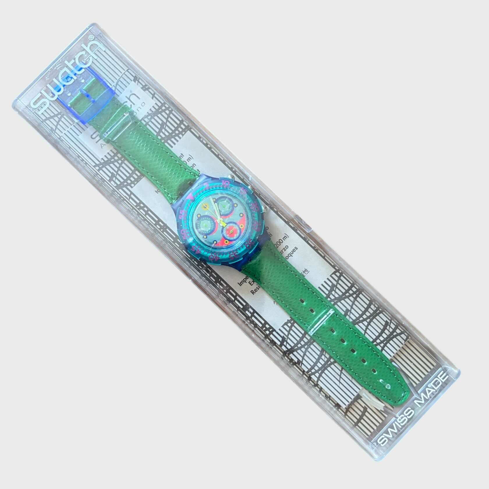 Scatola Swatch Aqua Chrono Blue Sky SBN100 del 1993 Cinturino in pelle verde. quadrante blu e fucsia